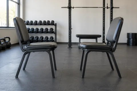 two gym chairs facing each other.