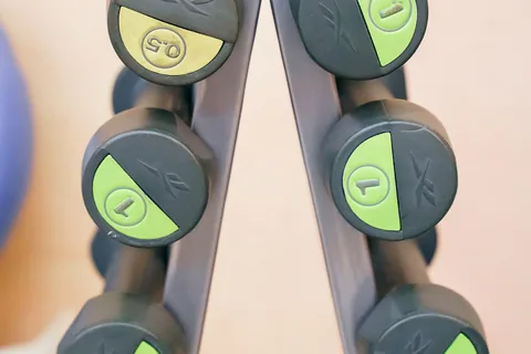 A rack of dumbbells arranged in pairs.