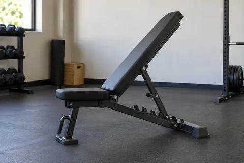 Adjustable weight bench with locked backrest in an incline position.